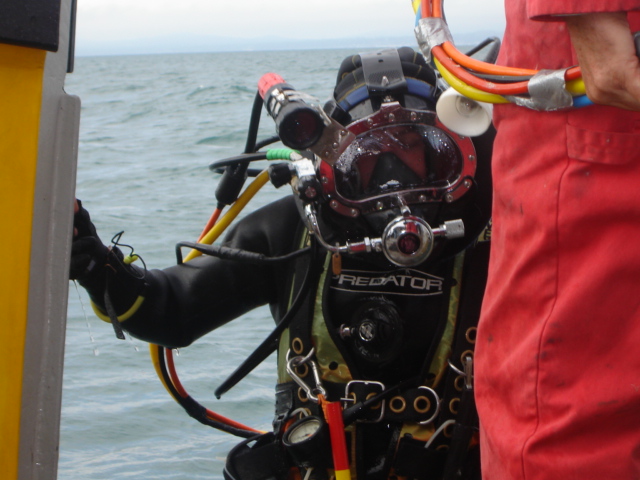 A surface supply diver returning from a dive